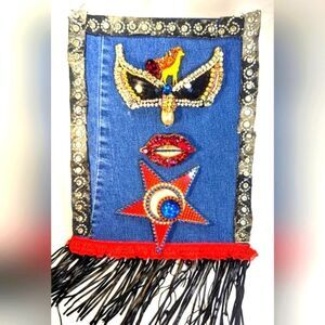 Wendy Gell Art canvas on denim bejeweled lips, encrusted sunglasses and fringe.